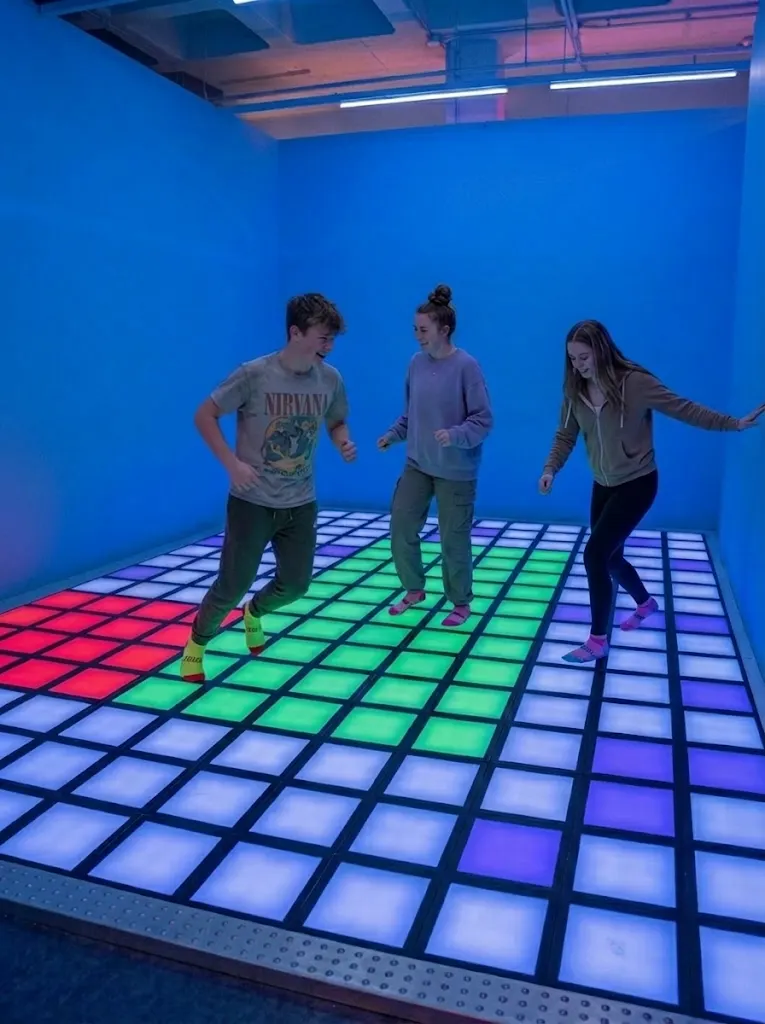 Children playing on the colourful light floor